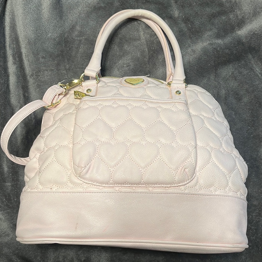 Used Betsy Johnson pink quilted bag.